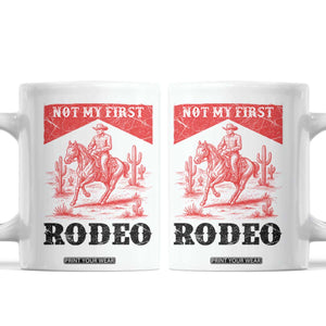 Not My First Rodeo Vintage Cowboy Graphic Coffee Mug Retro Western Desert Scene with Horse and Cactus TS02 White Print Your Wear