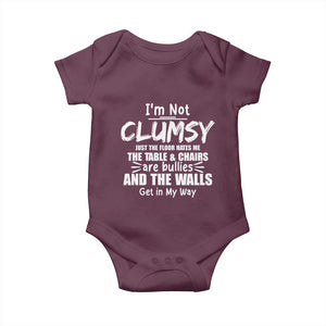 Funny Clumsy People Saying Baby Onesie The Floor Hates Me The Table And Chairs Are Bullies The Walls Get In My Way TS02 Maroon Print Your Wear