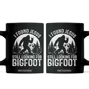 Funny Christian Sasquatch Coffee Mug I Found Jesus Still Looking for Bigfoot Vintage Distressed Graphic TS02 Black Print Your Wear