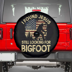 I Found Jesus Still Looking for Bigfoot Patriotic Spare Tire Cover American Flag Christian Religious Sasquatch Vintage TS02 Black Print Your Wear