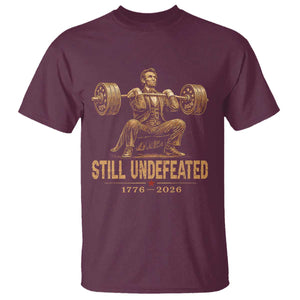 Funny Abraham Lincoln Squatting Barbell Semiquincentennial T Shirt Still Undefeated 1776 to 2026 Muscular President Gym Bodybuilder