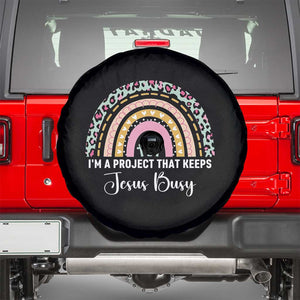 I am a Project That Keeps Jesus Busy Rainbow Cross Spare Tire Cover Cute Christian Faith Humor TS02 Black Print Your Wear