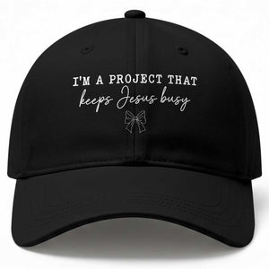 I am a Project That Keeps Jesus Busy Coquette Bow Baseball Cap Christian Faith Humor
