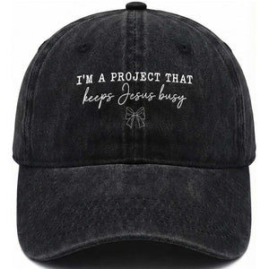 I am a Project That Keeps Jesus Busy Coquette Bow Washed Cotton Baseball Cap Christian Faith Humor