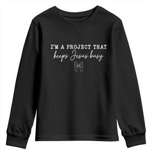 I am a Project That Keeps Jesus Busy Coquette Bow Youth Sweatshirt Christian Faith Humor TS02 Black Print Your Wear