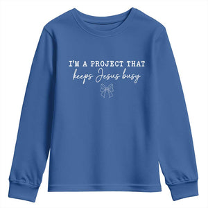 I am a Project That Keeps Jesus Busy Coquette Bow Youth Sweatshirt Christian Faith Humor TS02 Royal Blue Print Your Wear