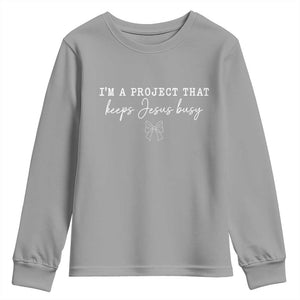 I am a Project That Keeps Jesus Busy Coquette Bow Youth Sweatshirt Christian Faith Humor TS02 Sport Gray Print Your Wear