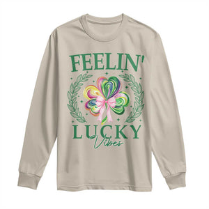 St. Patrick's Day Long Sleeve Shirt Feelin' Lucky Vibes Shamrock Coquette Bow TS09 Sand Print Your Wear