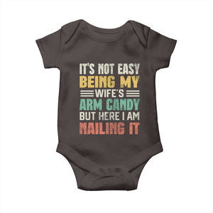 Funny Husband Baby Onesie It's Not Easy Being My Wife's Arm Candy TS09 Dark Chocolate Print Your Wear
