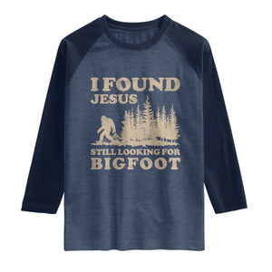 Retro I Found Jesus Still Looking For Bigfoot Raglan Shirt Vintage Sasquatch Believer Funny Christian Humor TS10 Heather Denim Navy Print Your Wear