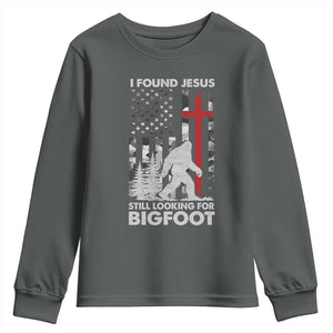 Retro I Found Jesus Still Looking For Bigfoot Youth Sweatshirt Camouflage US American Flag Camo TS10 Dark Heather Print Your Wear