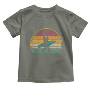 Vintage Bigfoot Surfing Toddler T Shirt Sasquatch Beach Vacation Retro Surf Sun Shaka TS10 Military Green Print Your Wear