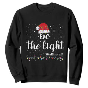 Be The Light Christmas Sweatshirt Christian Religious Bible Verse Santa Hat Pajama TS10 Black Print Your Wear