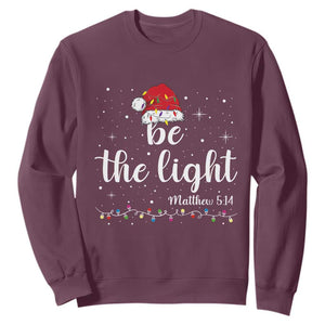 Be The Light Christmas Sweatshirt Christian Religious Bible Verse Santa Hat Pajama TS10 Maroon Print Your Wear