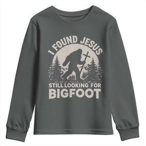 I Found Jesus Still Looking For Bigfoot Youth Sweatshirt Funny Christian Sasquatch Forest TS11 Dark Heather Print Your Wear