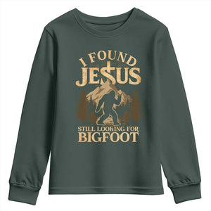 I Found Jesus Still Looking For Bigfoot Youth Sweatshirt Funny Christian Sasquatch Vintage Mountain TS11 Dark Forest Green Print Your Wear