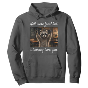 Y'all Were Feral But I Lowkey Love You Hoodie Funny Raccoon Teacher TS11 Dark Heather Print Your Wear