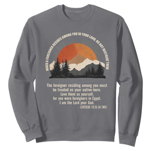 When A Foreigner Resides Among You In Your Land Do Not Mistreat Them Sweatshirt Leviticus Bible Verse TS11 Charcoal Print Your Wear