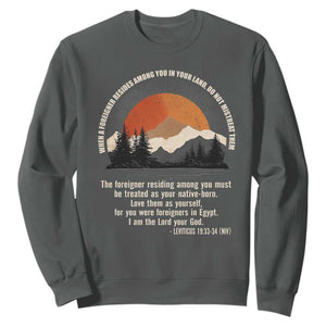 When A Foreigner Resides Among You In Your Land Do Not Mistreat Them Sweatshirt Leviticus Bible Verse TS11 Dark Heather Print Your Wear
