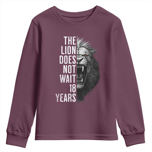 Funny The Lion Does Not Wait 18 Years Youth Sweatshirt Lion Meme Gen Z Alpha TS11 Maroon Print Your Wear