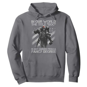 Combat Medic Hoodie In Our World The Title Doc Is Not Earned Form A Fancy Degree TS11 Charcoal Print Your Wear