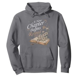 A New Chapter Begins Retired 2026 Hoodie Retired Teacher Floral Book TS11 Charcoal Print Your Wear