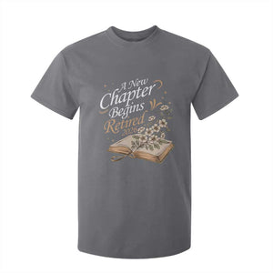 A New Chapter Begins Retired 2026 T Shirt For Kid Retired Teacher Floral Book TS11 Charcoal Print Your Wear