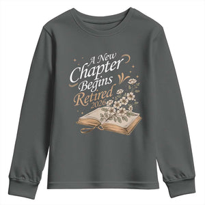 A New Chapter Begins Retired 2026 Youth Sweatshirt Retired Teacher Floral Book TS11 Dark Heather Print Your Wear