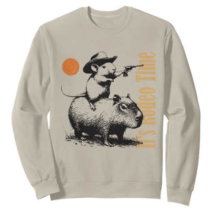 It Is Rodeo Time Sweatshirt Funny Wild West Mouse Riding Capybara TS12 Sand Print Your Wear