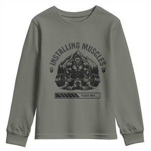 Installing Muscles Please Wait Youth Sweatshirt Bigfoot Funny Gym Workout Gift TS12 Military Green Print Your Wear