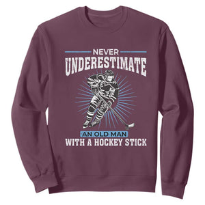 Never Underestimate An Old Man With A Hockey Stick Sweatshirt Ice Hockey Gift TS12 Maroon Print Your Wear