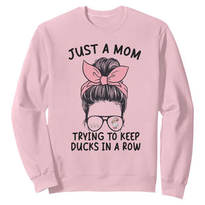 Just A Mom Trying To Keep Her Ducks In A Row Sweatshirt Funny Duck Mom Messy Hair Bun Moms Life TS14 Light Pink Print Your Wear
