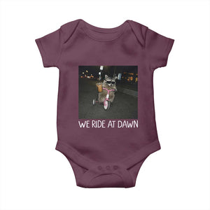 We Ride at Dawn Baby Onesie Funny Racoon Riding Tricycle Chaotic Meme