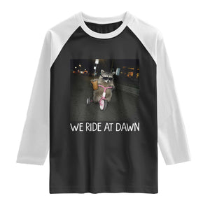 We Ride at Dawn Raglan Shirt Funny Racoon Riding Tricycle Chaotic Meme