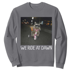 We Ride at Dawn Sweatshirt Funny Racoon Riding Tricycle Chaotic Meme