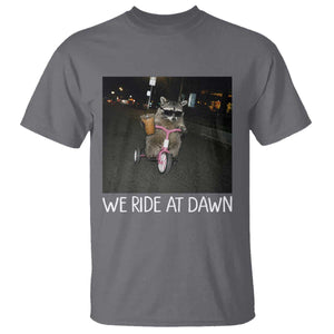 We Ride at Dawn T Shirt Funny Racoon Riding Tricycle Chaotic Meme