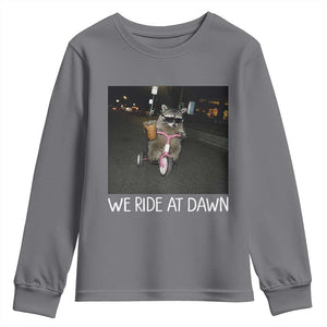 We Ride at Dawn Youth Sweatshirt Funny Racoon Riding Tricycle Chaotic Meme