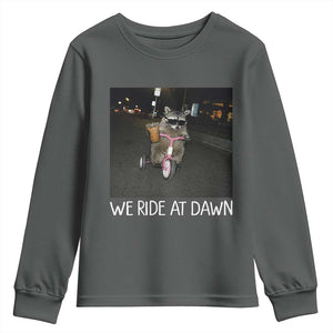 We Ride at Dawn Youth Sweatshirt Funny Racoon Riding Tricycle Chaotic Meme