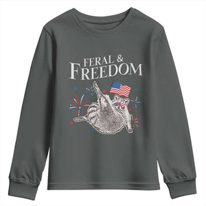Funny Feral And Free Youth Sweatshirt 4th of July Patriotic Raccoon With American Flag TS11 Dark Heather Print Your Wear