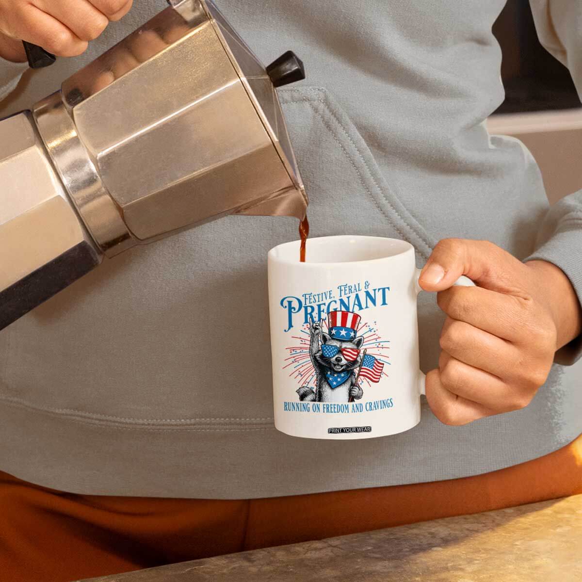 Funny Festive Feral and Pregnant Coffee Mug Running On Freedom And Cravings 4th of July Maternity Raccoon TS11 Print Your Wear