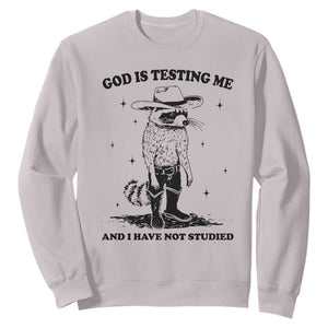 Funny God Is Testing Me And I Have Not Studied Sweatshirt Cowboy Racoon TS11 Ice Gray Print Your Wear