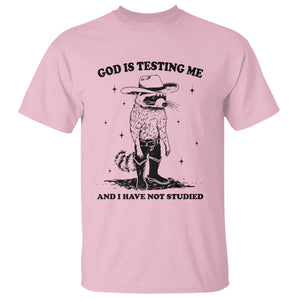 Funny God Is Testing Me And I Have Not Studied T Shirt Cowboy Racoon TS11 Light Pink Print Your Wear