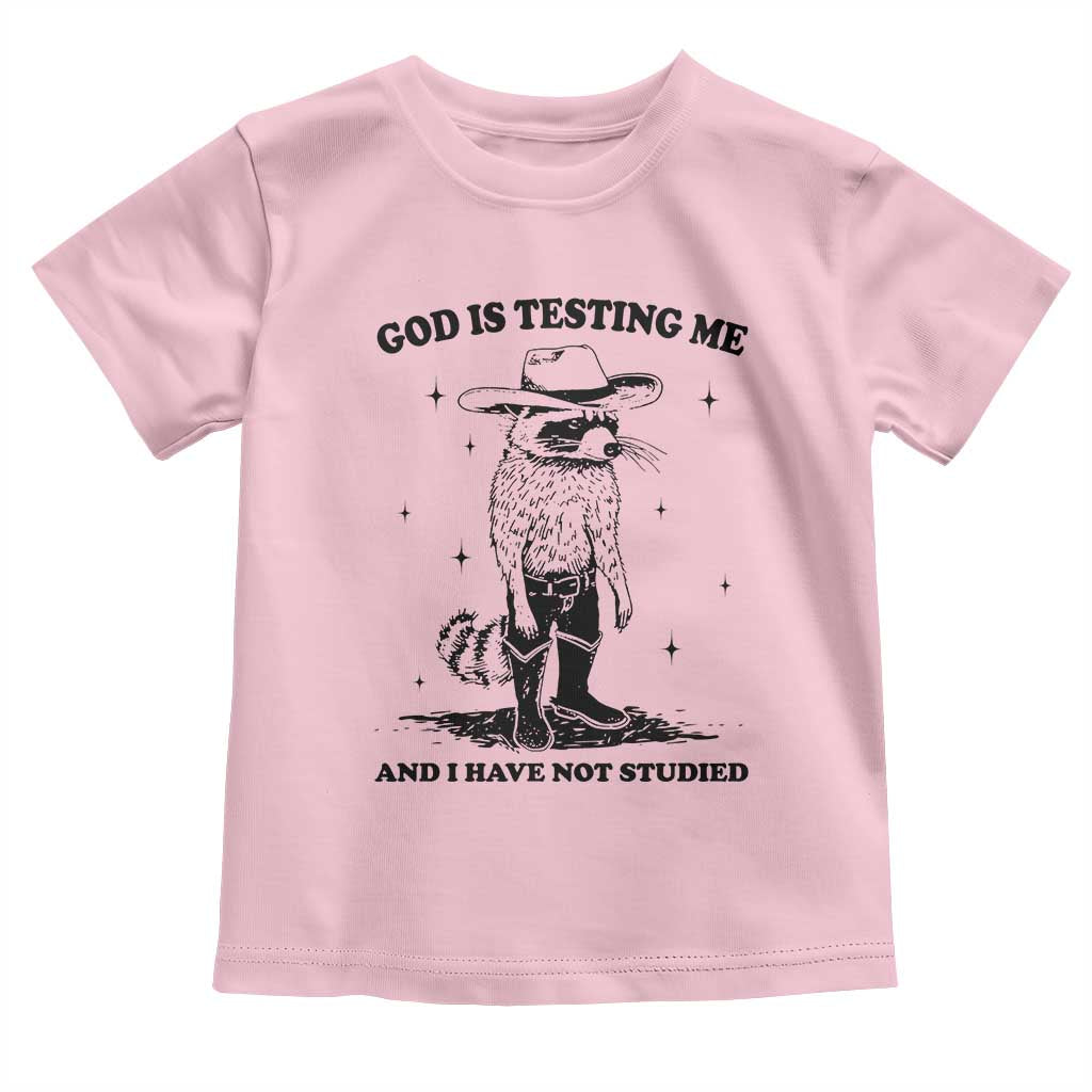 Funny God Is Testing Me And I Have Not Studied Toddler T Shirt Cowboy Racoon TS11 Light Pink Print Your Wear