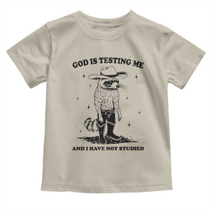 Funny God Is Testing Me And I Have Not Studied Toddler T Shirt Cowboy Racoon TS11 Sand Print Your Wear