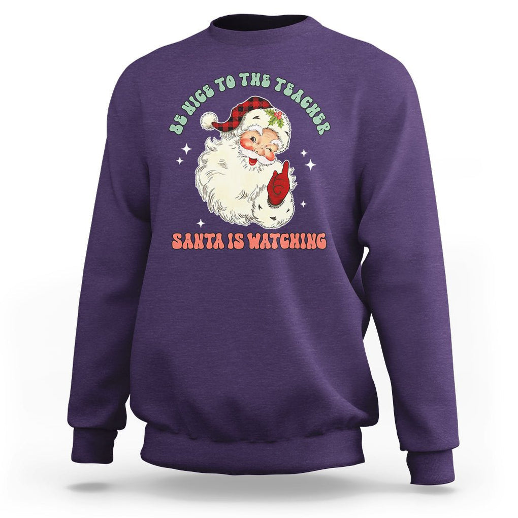 Be Nice To The Teacher Santa Is Watching Retro Groovy Christmas Sweatshirt TS02 Purple Printyourwear