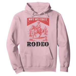 Not My First Rodeo Vintage Cowboy Graphic Hoodie Retro Western Desert Scene with Horse and Cactus TS02 Light Pink Print Your Wear