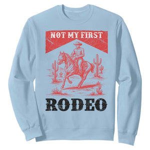 Not My First Rodeo Vintage Cowboy Graphic Sweatshirt Retro Western Desert Scene with Horse and Cactus TS02 Light Blue Print Your Wear