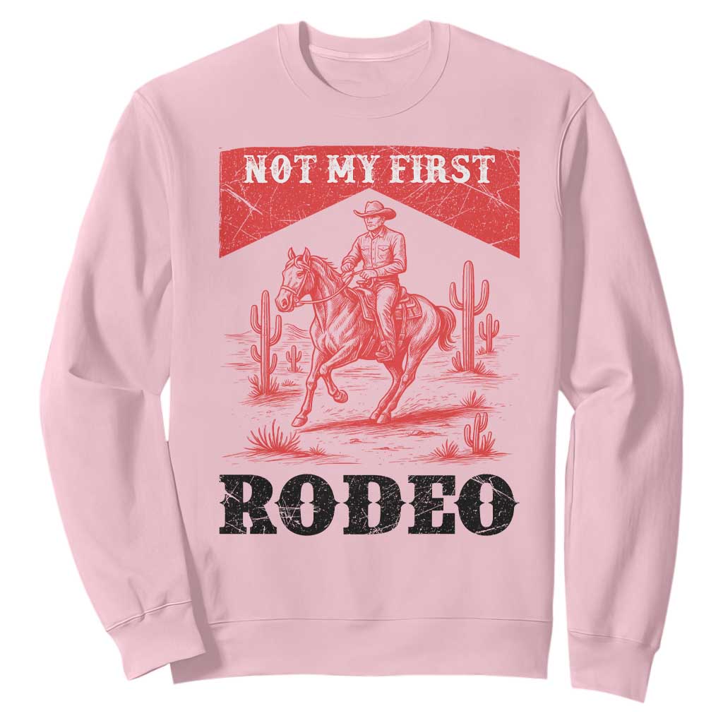Not My First Rodeo Vintage Cowboy Graphic Sweatshirt Retro Western Desert Scene with Horse and Cactus TS02 Light Pink Print Your Wear