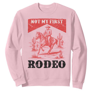 Not My First Rodeo Vintage Cowboy Graphic Sweatshirt Retro Western Desert Scene with Horse and Cactus TS02 Light Pink Print Your Wear
