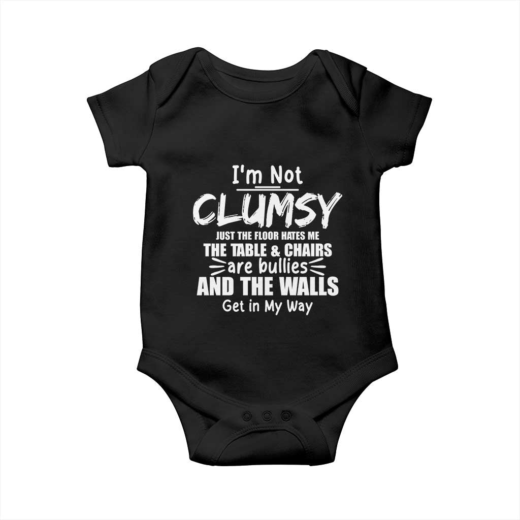 Funny Clumsy People Saying Baby Onesie The Floor Hates Me The Table And Chairs Are Bullies The Walls Get In My Way TS02 Black Print Your Wear